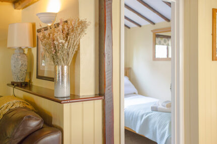 Lavender Cottage hallway looking into a bedroom
