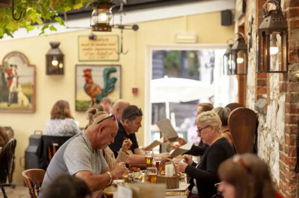 People enjoying meals inside the Dairyman's Daughter pub