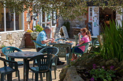 Couple enjoying a meal on the outside seating